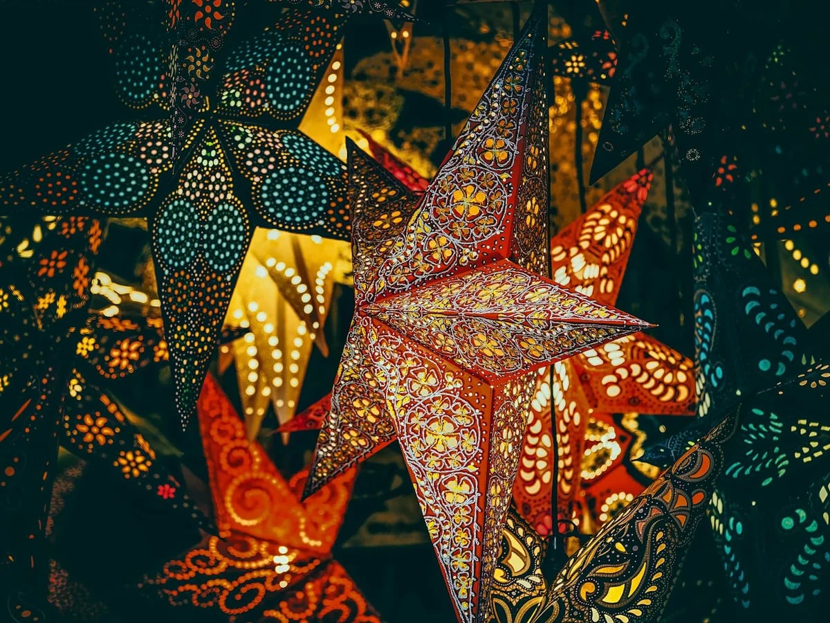 Freiburg im Breisgau intricately patterned star lanterns glowing in winter