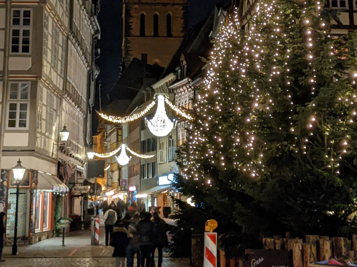 Weihnachtsmarkt Hannover illuminated by festive lights in Hannover Old Town atmosphere with Marktkirche spires