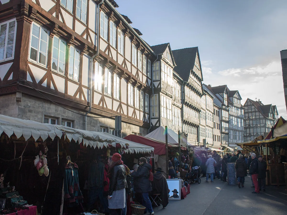 Weihnachtsmarkt Hannover - Holzmarkt bustling market activity Hannover historic atmosphere
