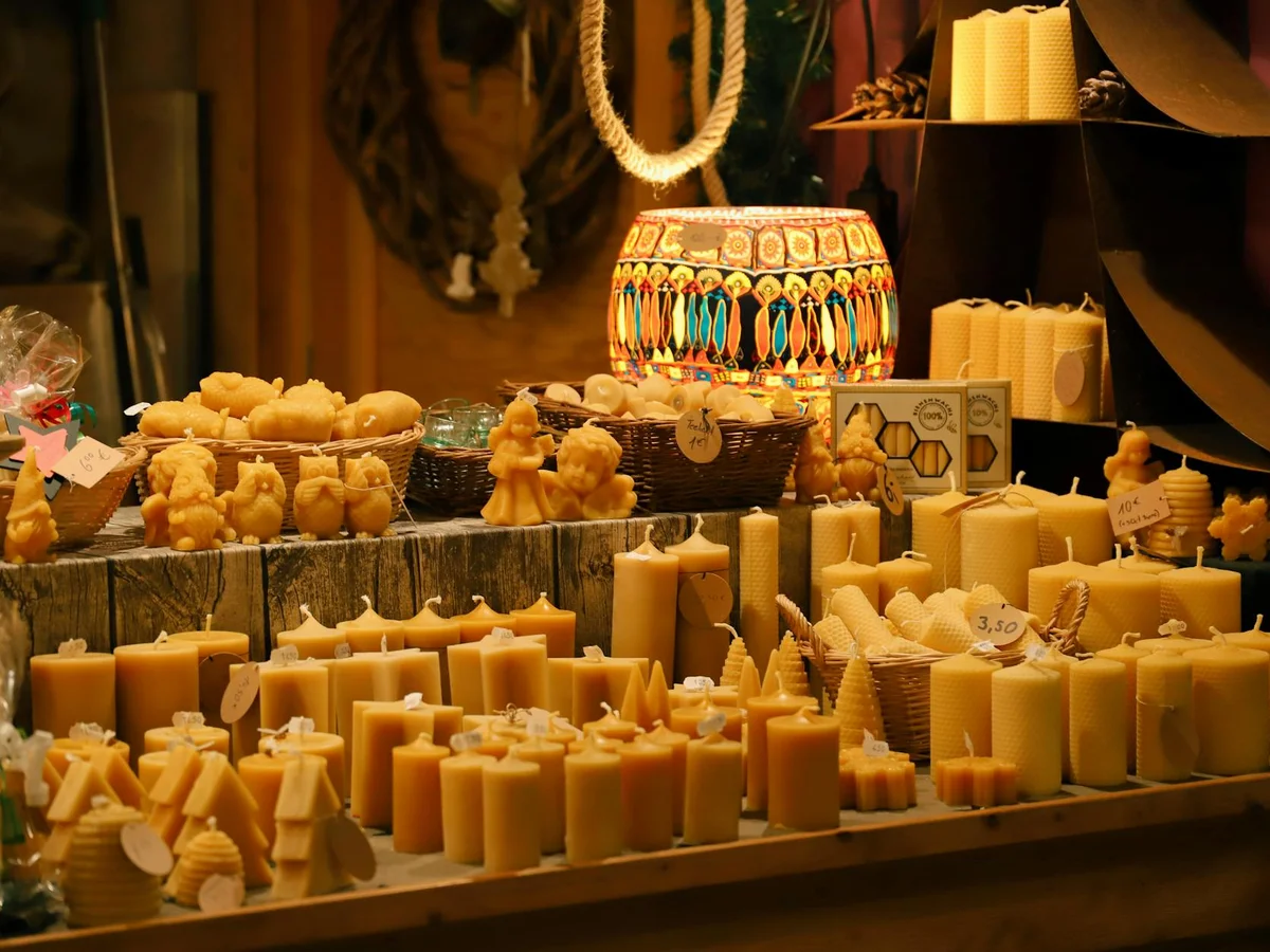 Kassel handmade beeswax candles at a Christmas market stall in winter