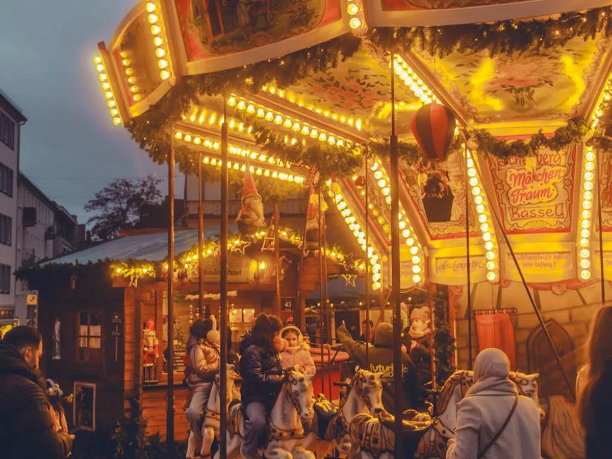 Kassel traditional carousel at Christmas market during blue hour