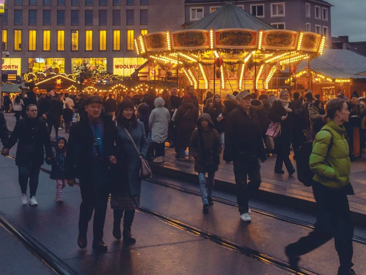 Kassel carousel shining brightly at the Christmas market during winter twilight