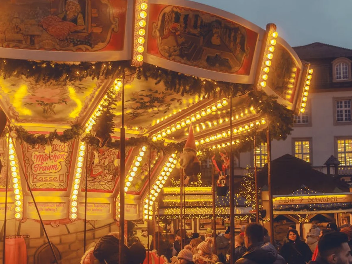 Kassel beautifully illuminated carousel at twilight during winter festivities