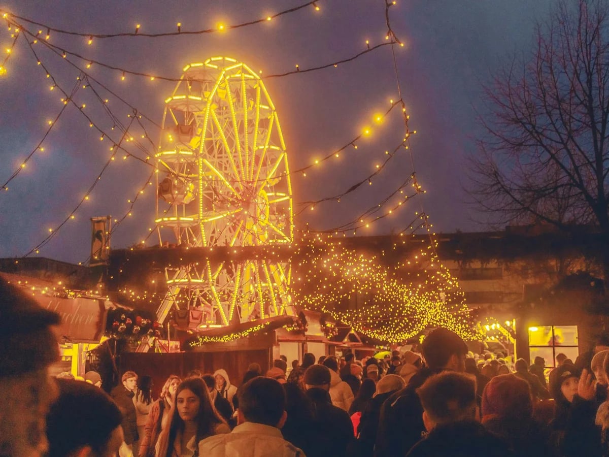 Kassel illuminated Ferris wheel during winter Christmas market