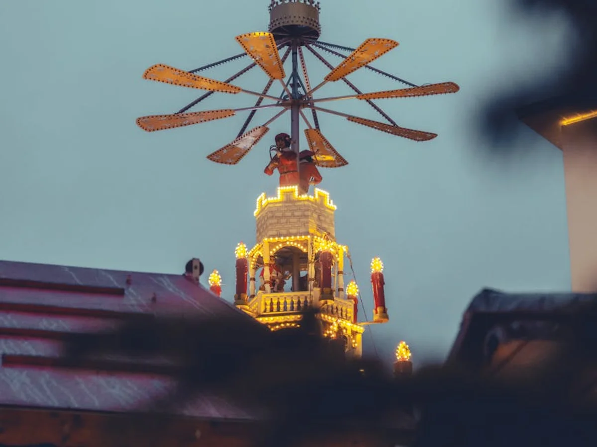 Kassel vintage carousel illuminated at dusk during winter season
