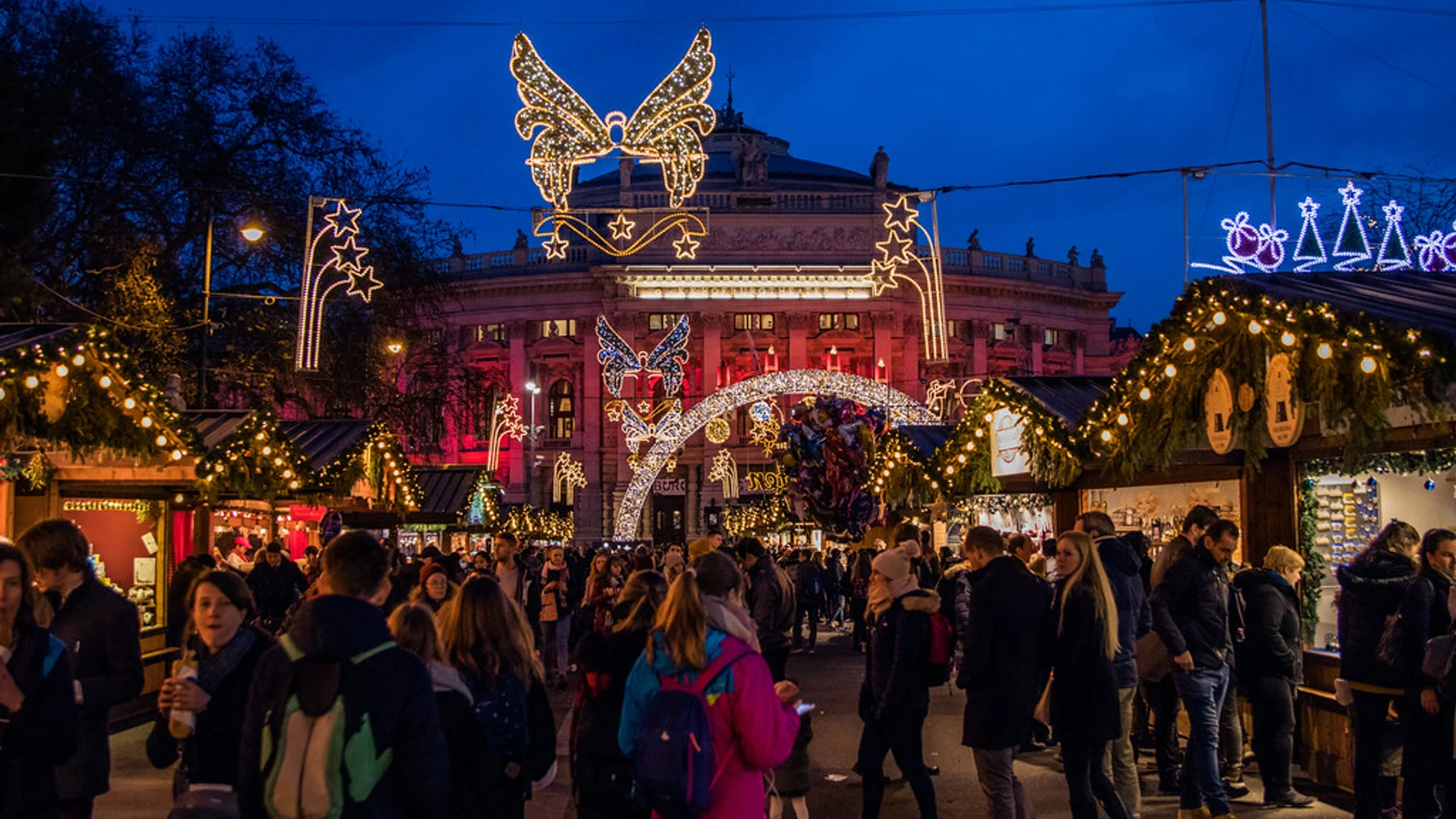 Weihnachtsmarkt am Rathaus glowing at twilight in Luneburg with festive lights and Rathausplatz ambiance