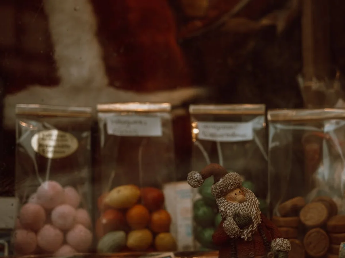 Monschau Christmas market closeup of a candy vendor's display with Santa figurine