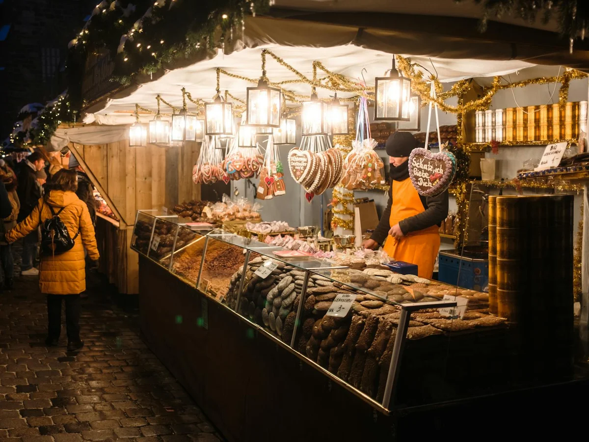 Nuremberg authentic gingerbread stall glowing in winter evening lights