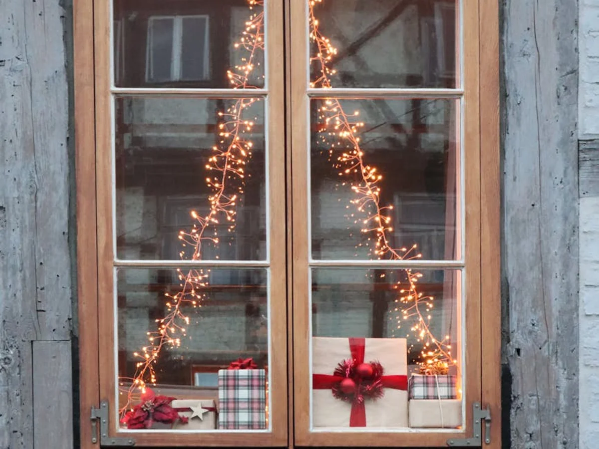 Quedlinburg half-timbered window adorned with Christmas gifts and warm lights