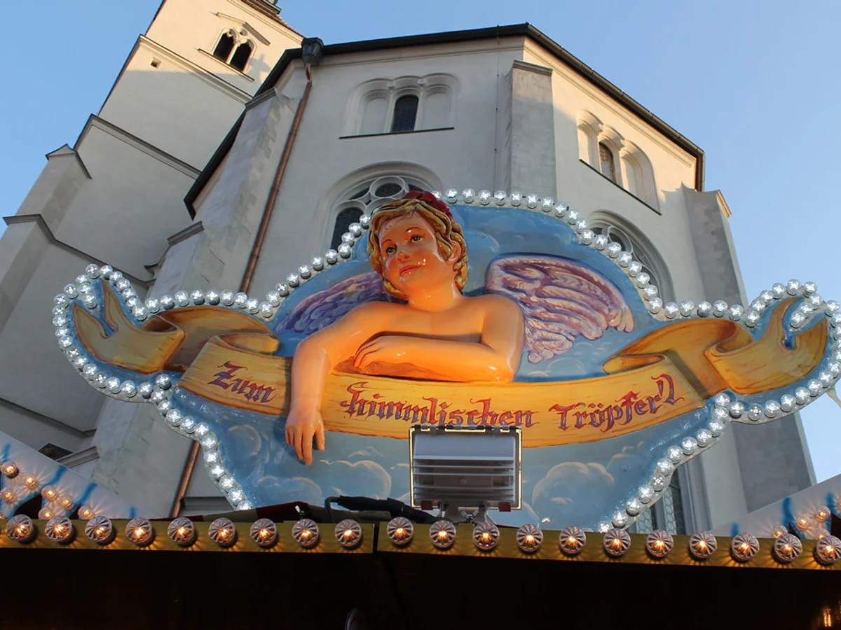 Christkindlmarkt - Neupfarrplatz ornate angel decoration Regensburg warm festive atmosphere Neupfarrkirche