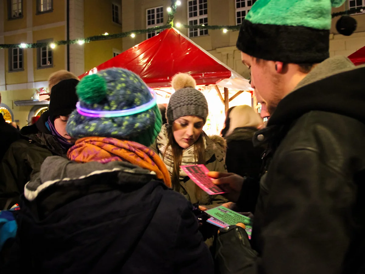 Lucreziamarkt - Haidplatz joyful visitors in Regensburg during magical blue hour with festive spirit