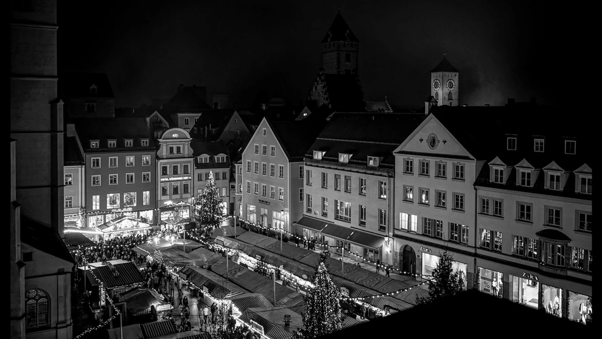 Lucreziamarkt stunning twilight view Regensburg Christmas market with Regensburger Dom spires