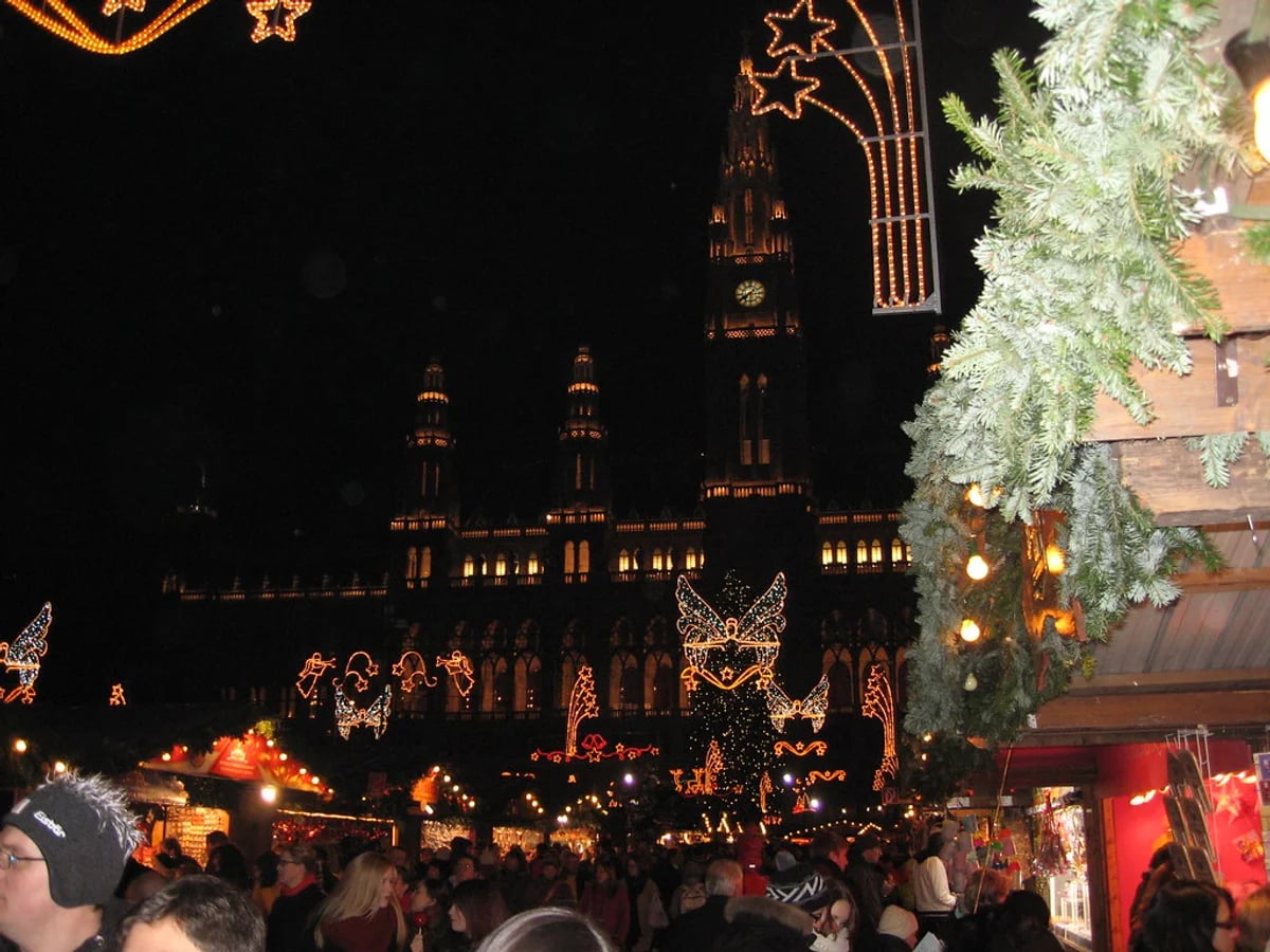 Lucreziamarkt festive atmosphere Regensburg illuminated by twin spires of Regensburger Dom