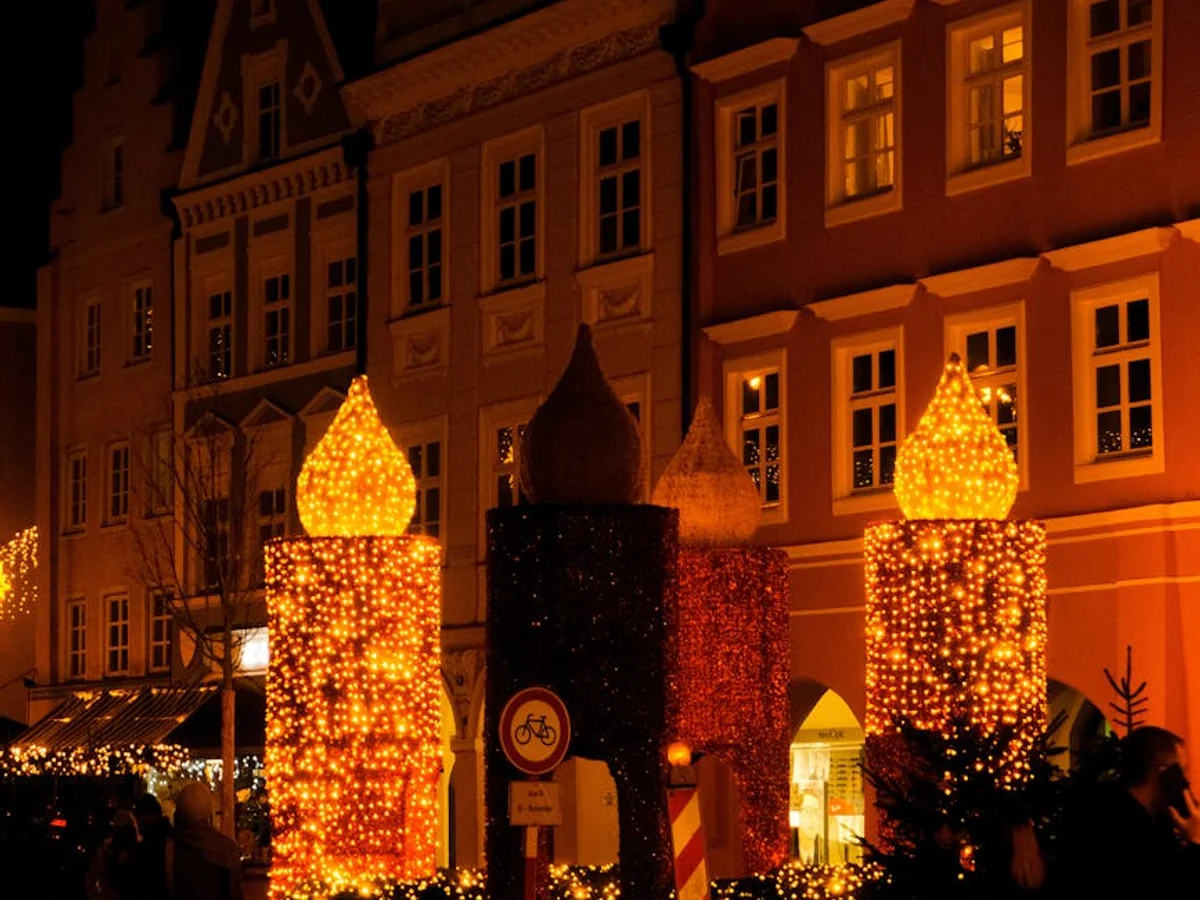 Regensburg historic architecture adorned with golden Christmas lights in winter