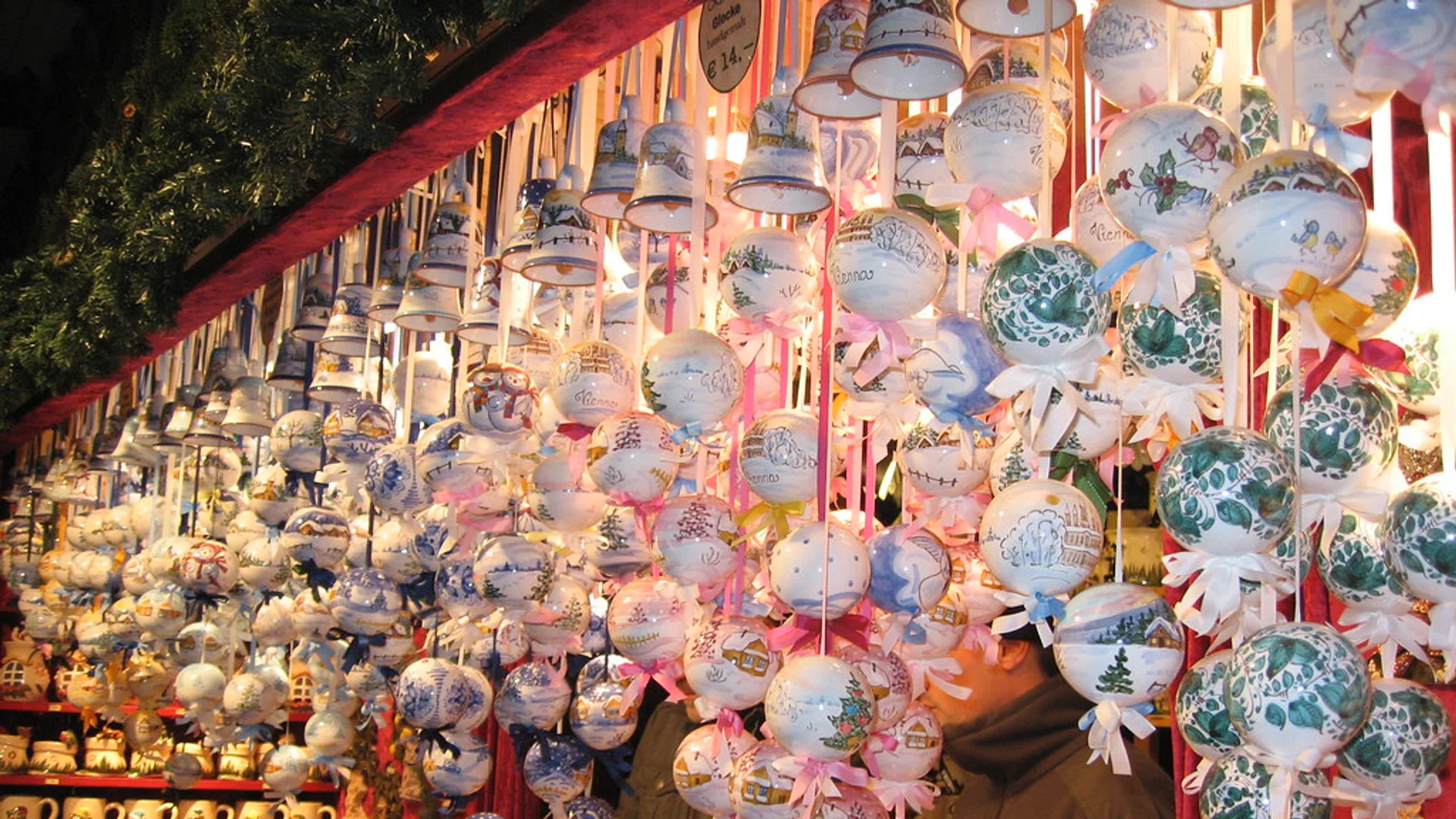 ventsmarkt vendor showcasing hand-painted ceramics at Regensburg Christmas market in Spitalgarten, St. Katharinenspital