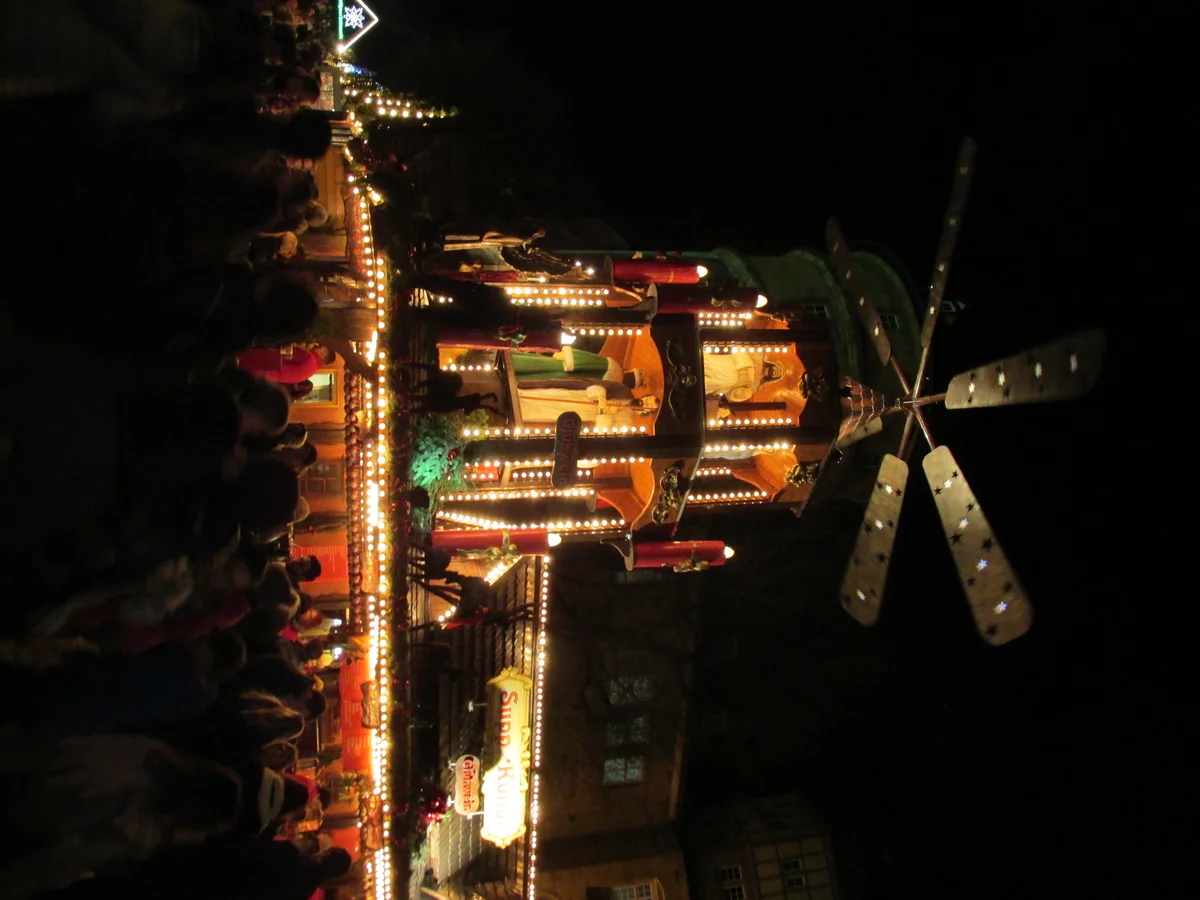 Stuttgart Christmas pyramid glowing in winter market ambiance