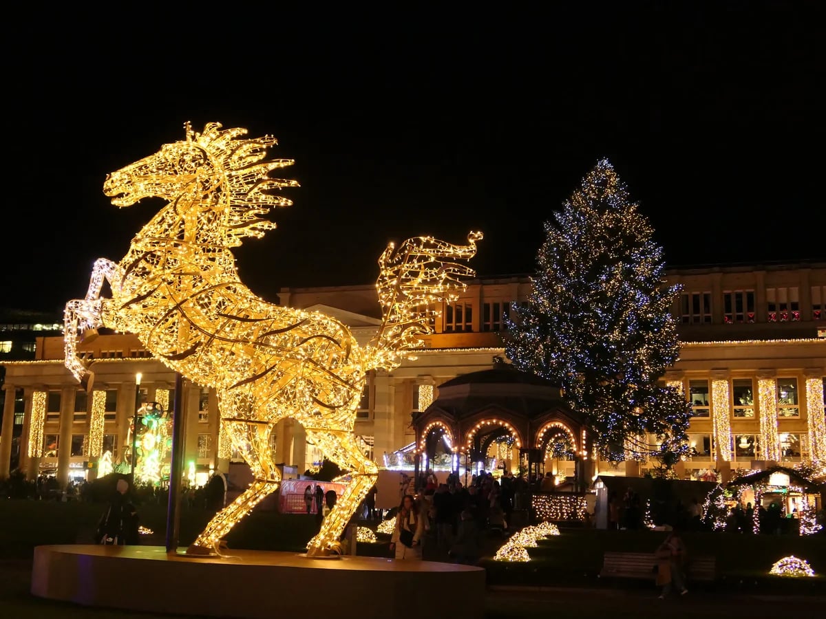 Stuttgart illuminated horse sculpture during festive winter season