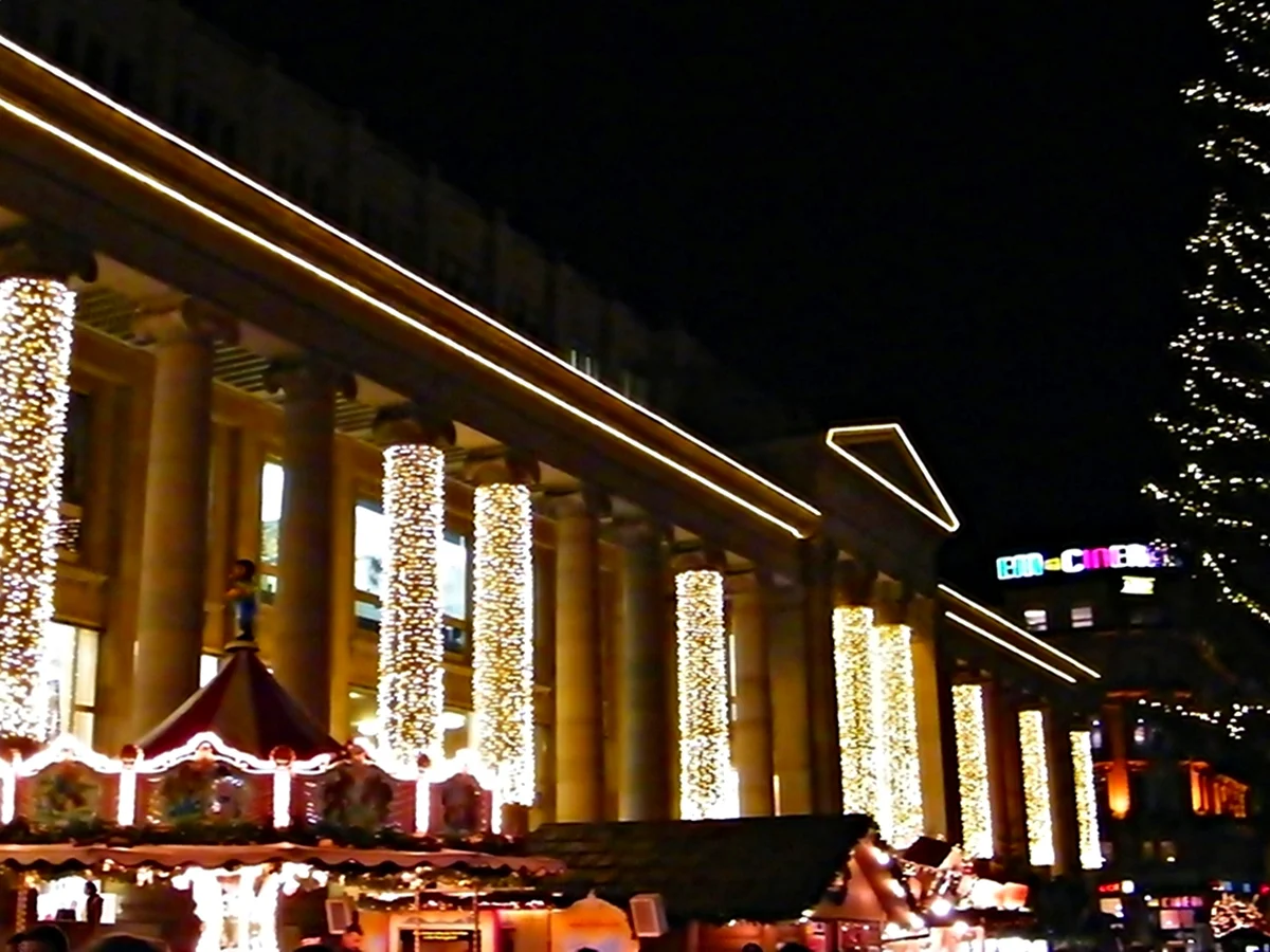 Stuttgart Königstraße colonnade adorned with festive lights during Christmas season