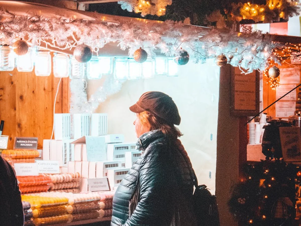 Budapest Christmas market stall glowing in warm lights during winter evening