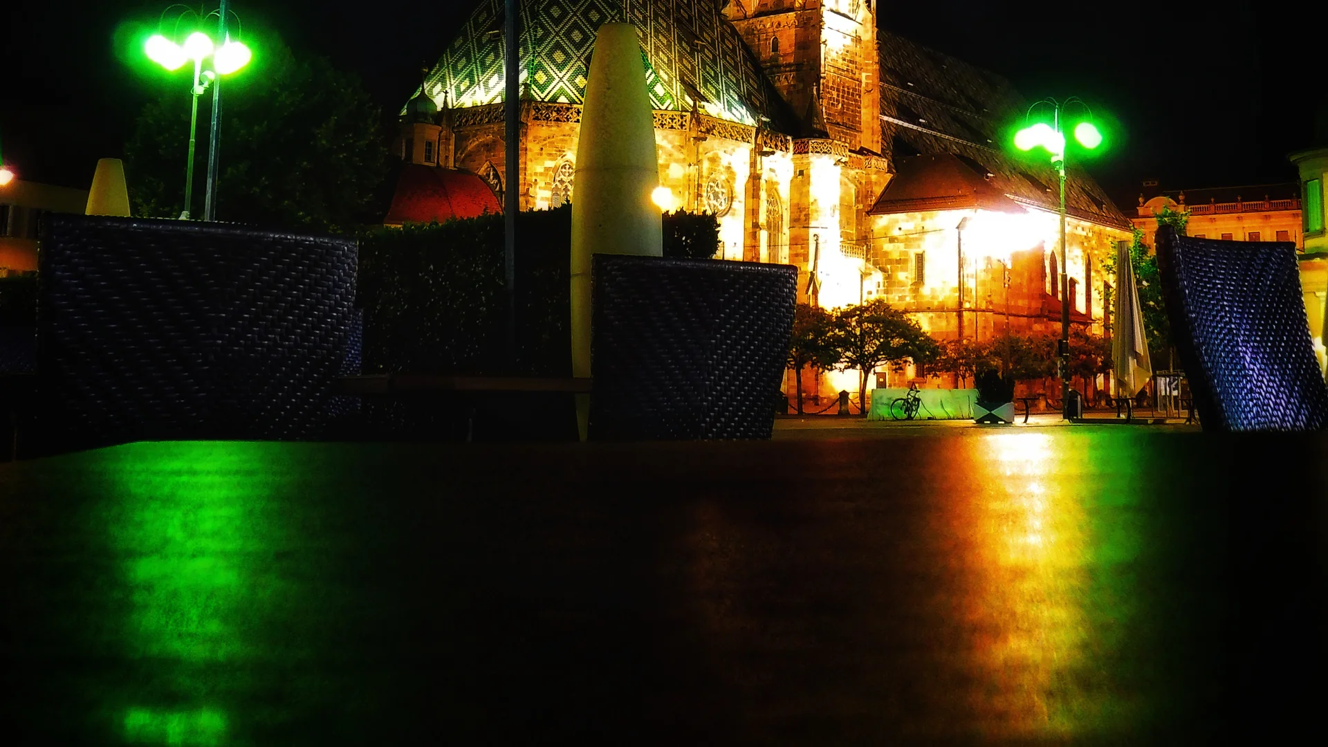 Bolzano Parish Church illuminated at night during Christmas season