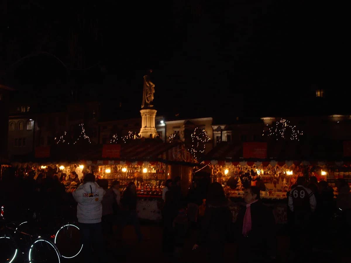 Bolzano Walther Monument illuminated during the enchanting Christmas market evening