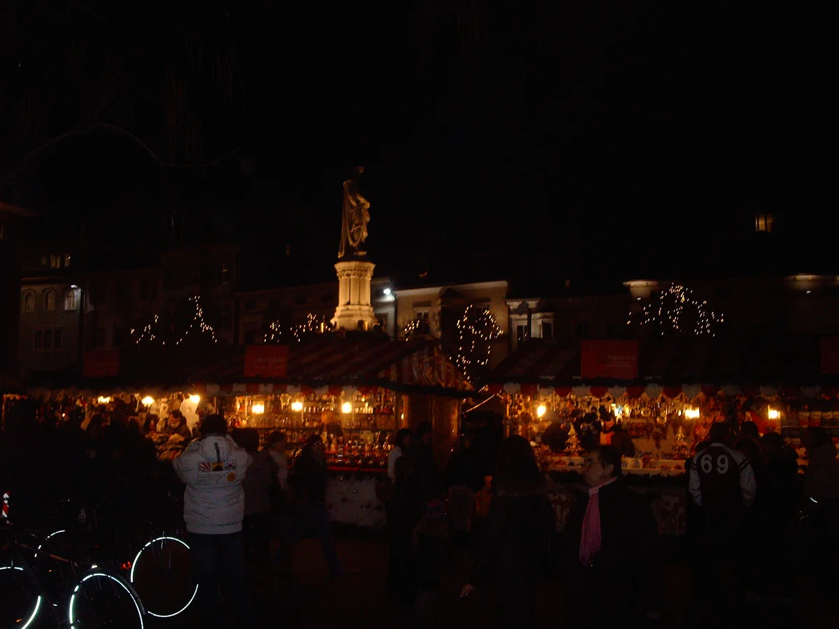 Bolzano Walther Monument illuminated during the enchanting Christmas market evening