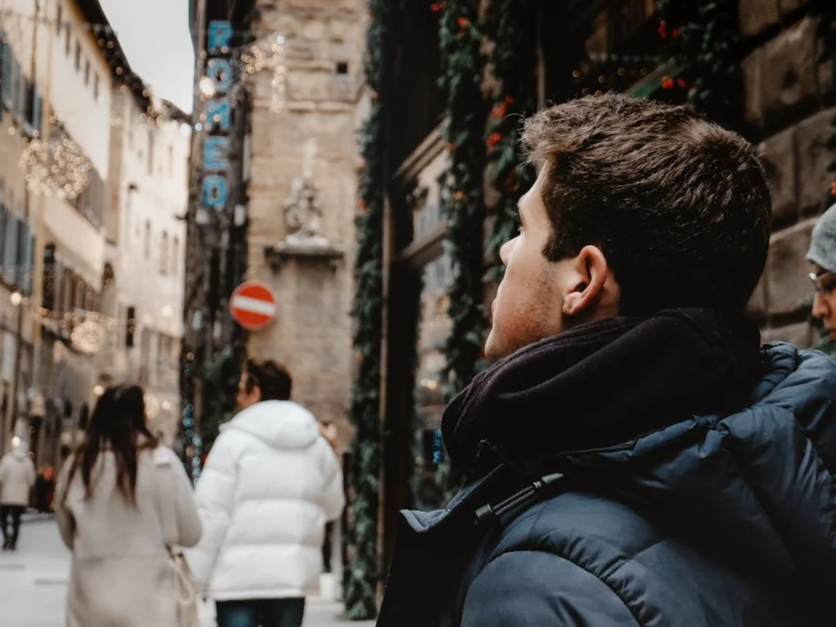 Florence festive medieval street adorned with Christmas lights and garland