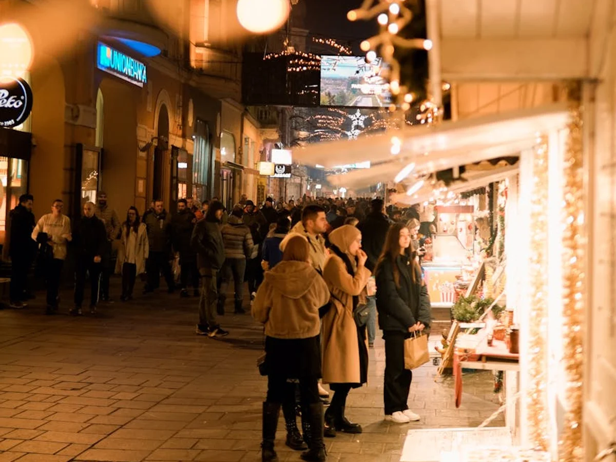 Turin festive street market illuminated in warm lights during winter season