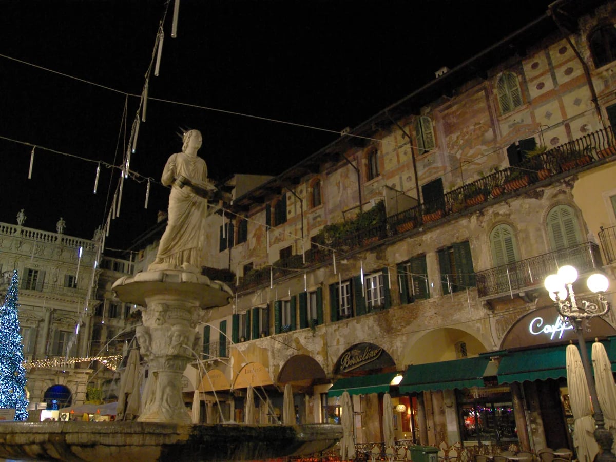 Verona Piazza delle Erbe adorned with blue Christmas lights in a magical winter atmosphere