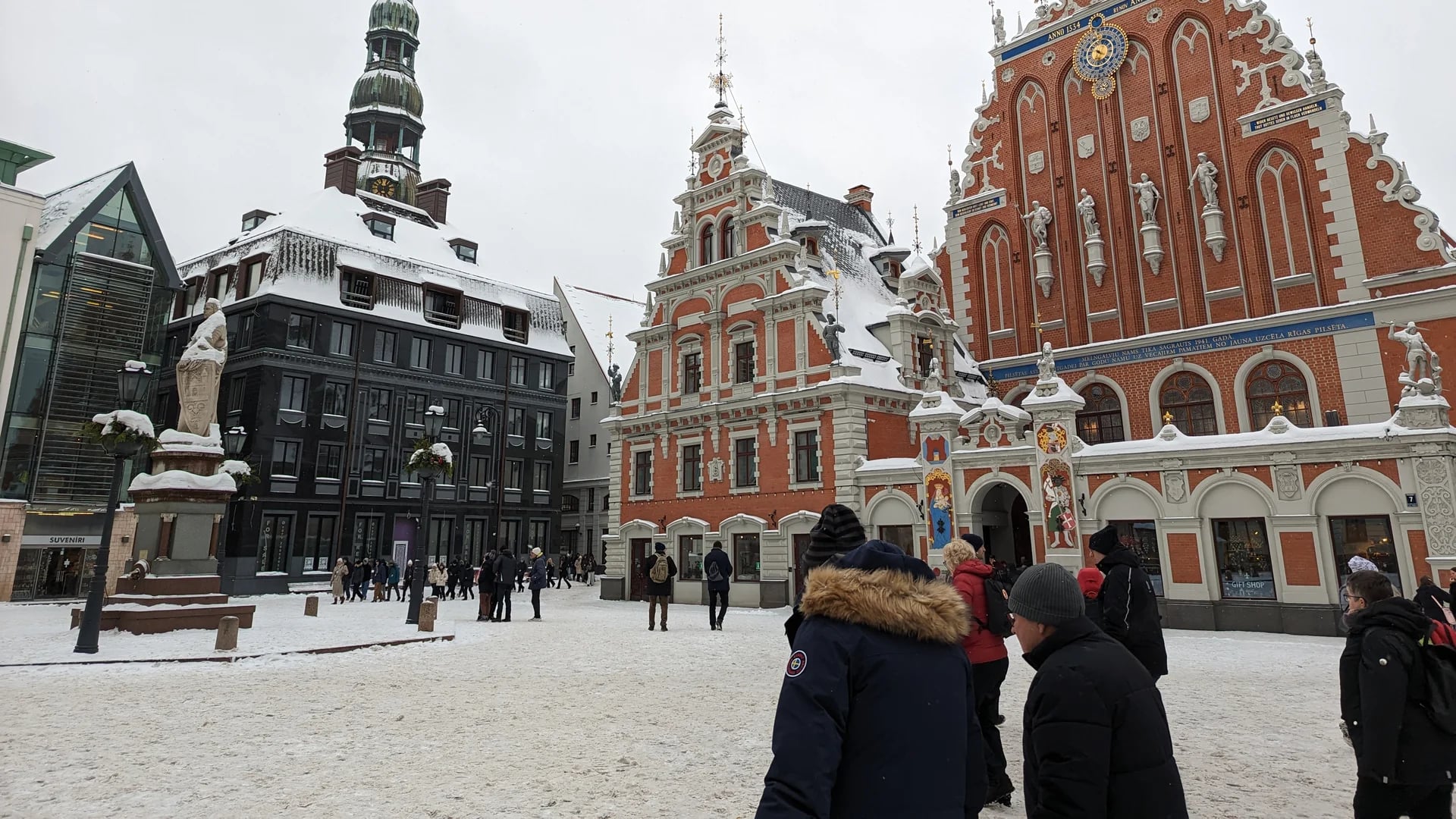 Riga Old Town square in winter snow showcasing medieval architecture