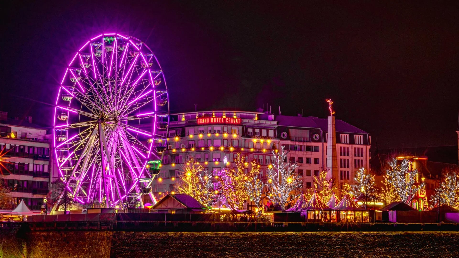 Luxembourg City iconic ferris wheel glowing during winter festivities