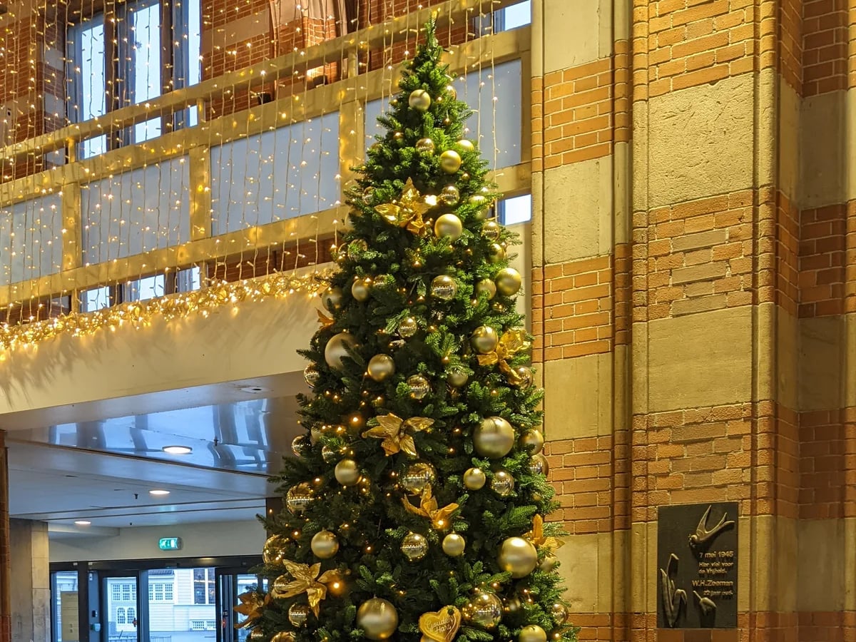 Amsterdam elegantly decorated Christmas tree in Central Train Station during winter season