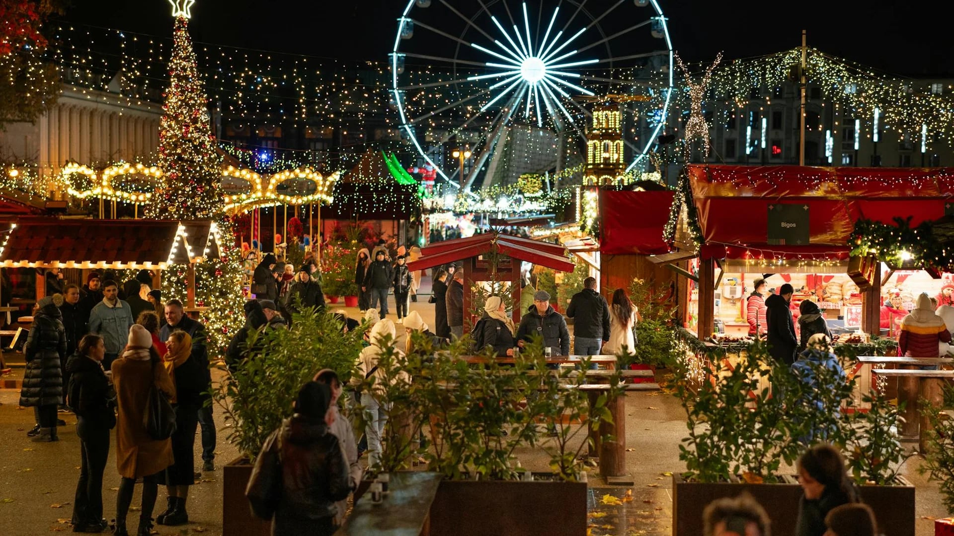 Poznan illuminated ferris wheel at Christmas market in winter night