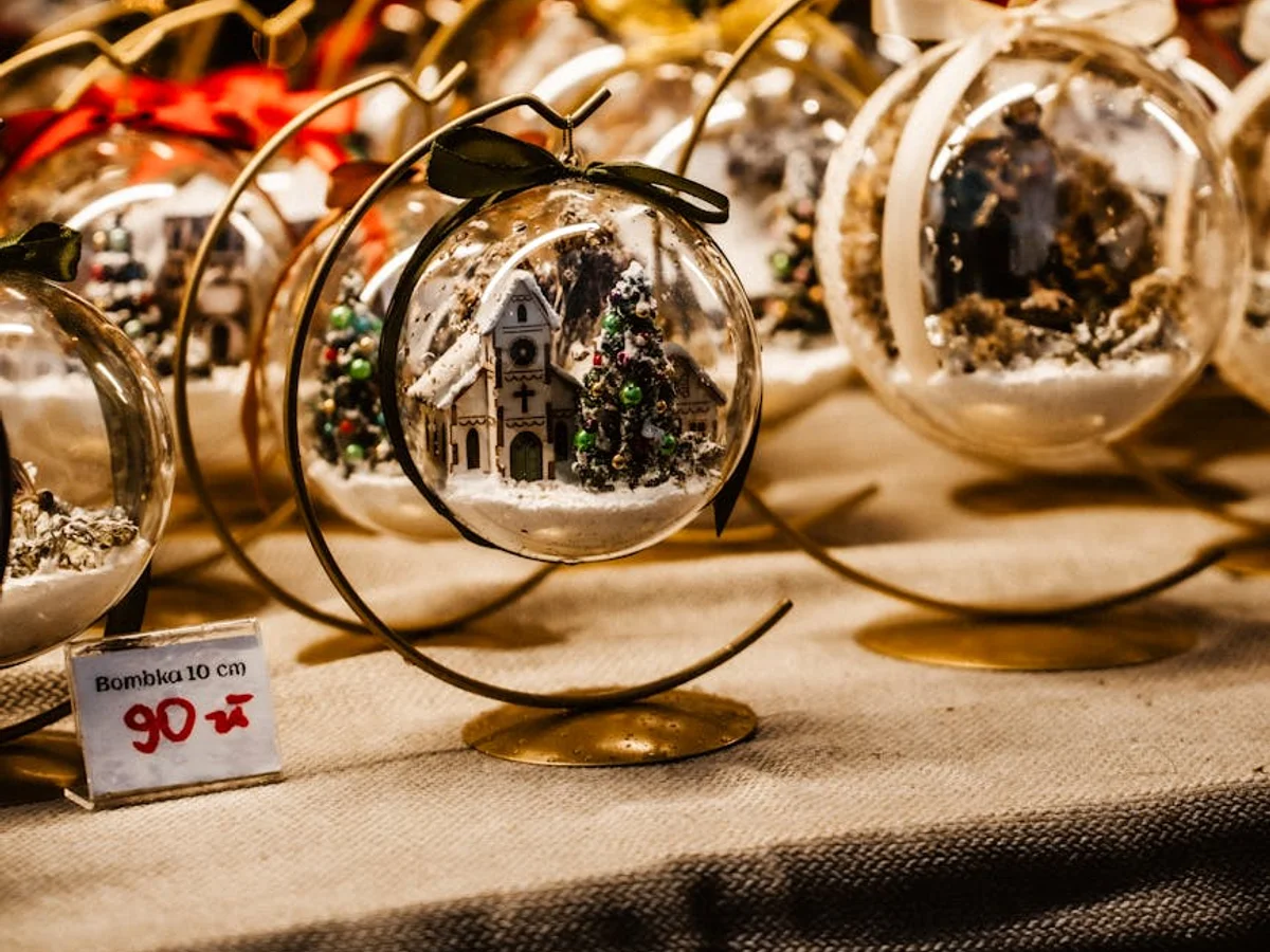 Torun handcrafted snow globe featuring winter architecture at Christmas market