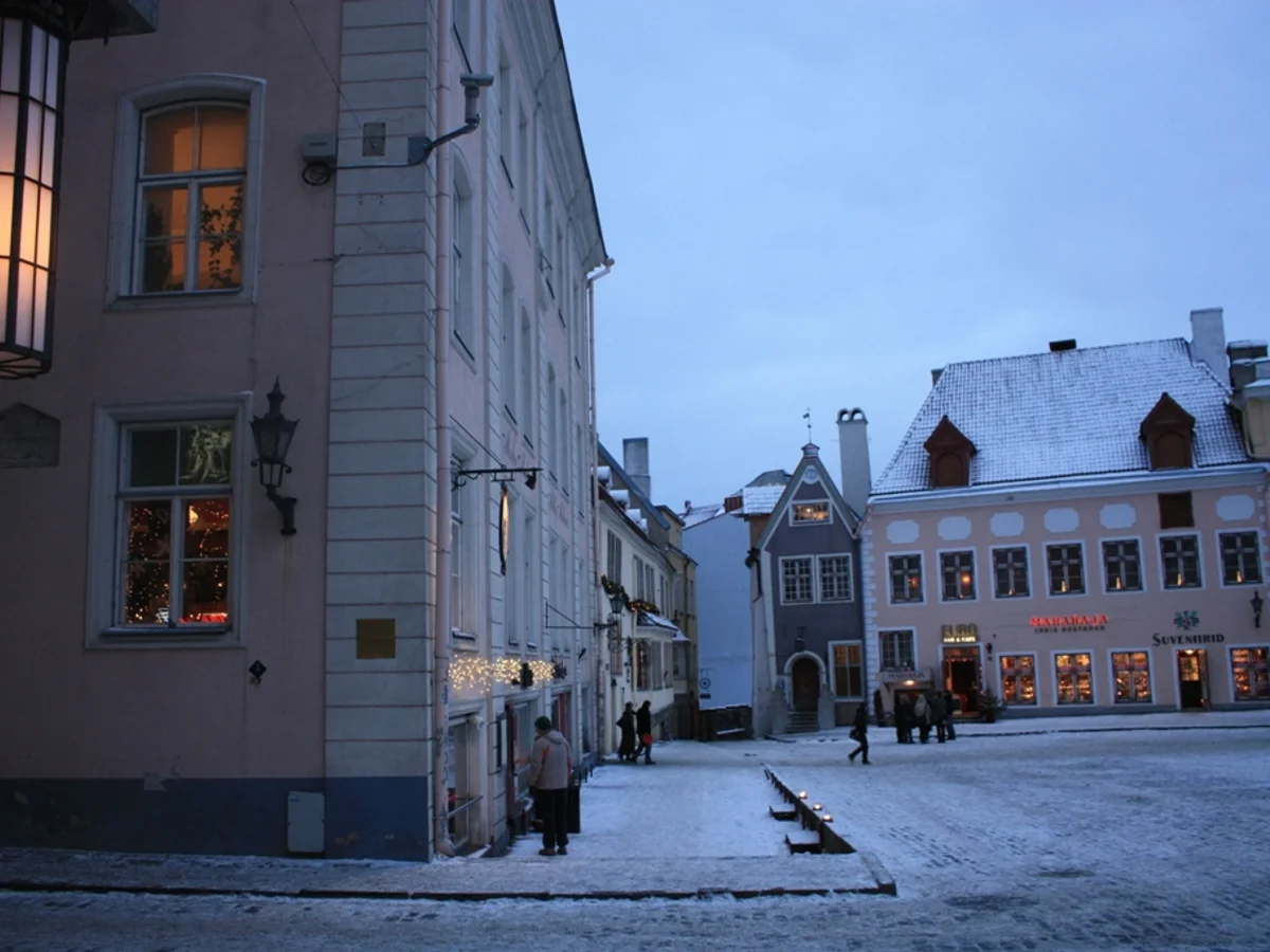Toruński Jarmark Bożonarodzeniowy glowing in twilight at Old Town Market Square, Torun's medieval charm