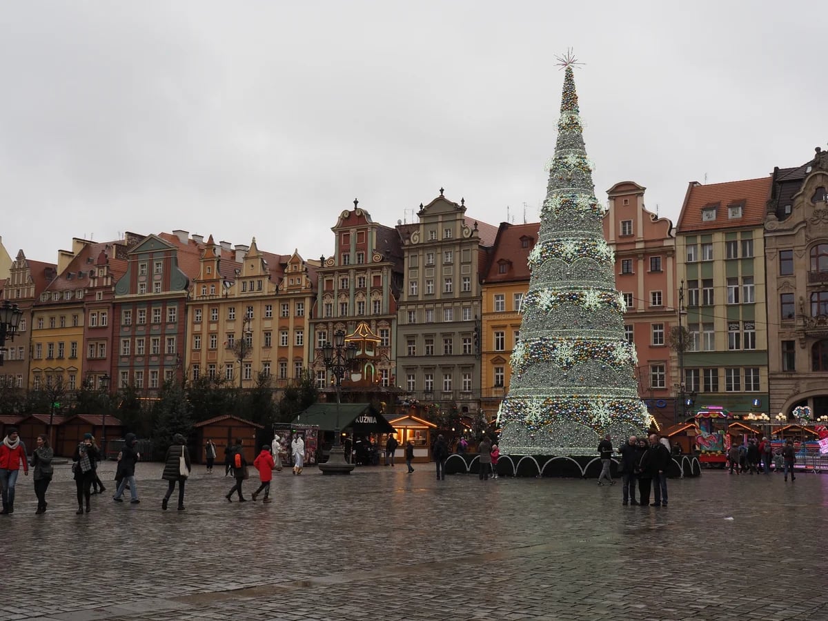 Wroclaw Market Square adorned with a central Christmas tree during winter festivities