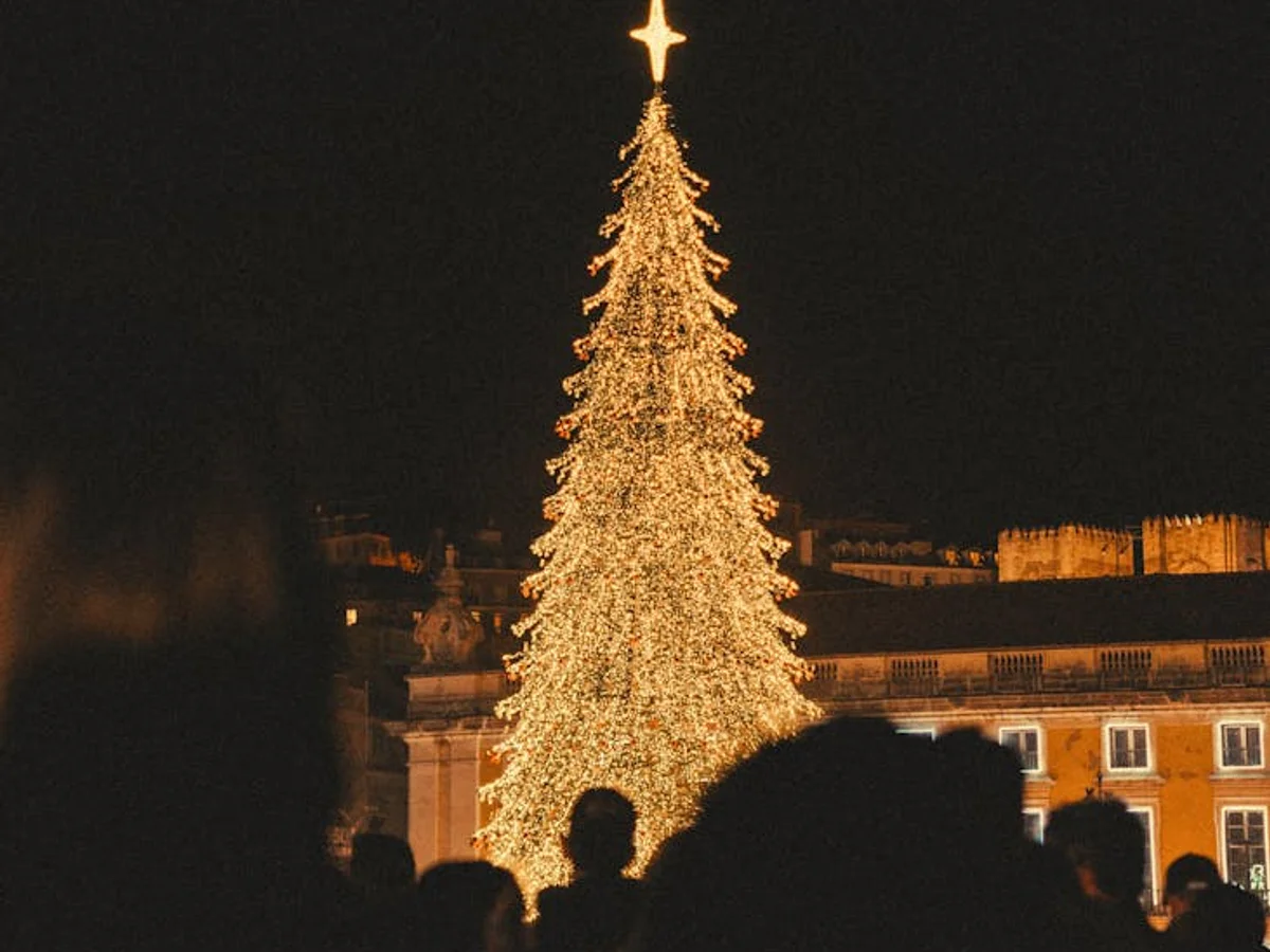 Lisbon golden Christmas tree shining bright in winter plaza