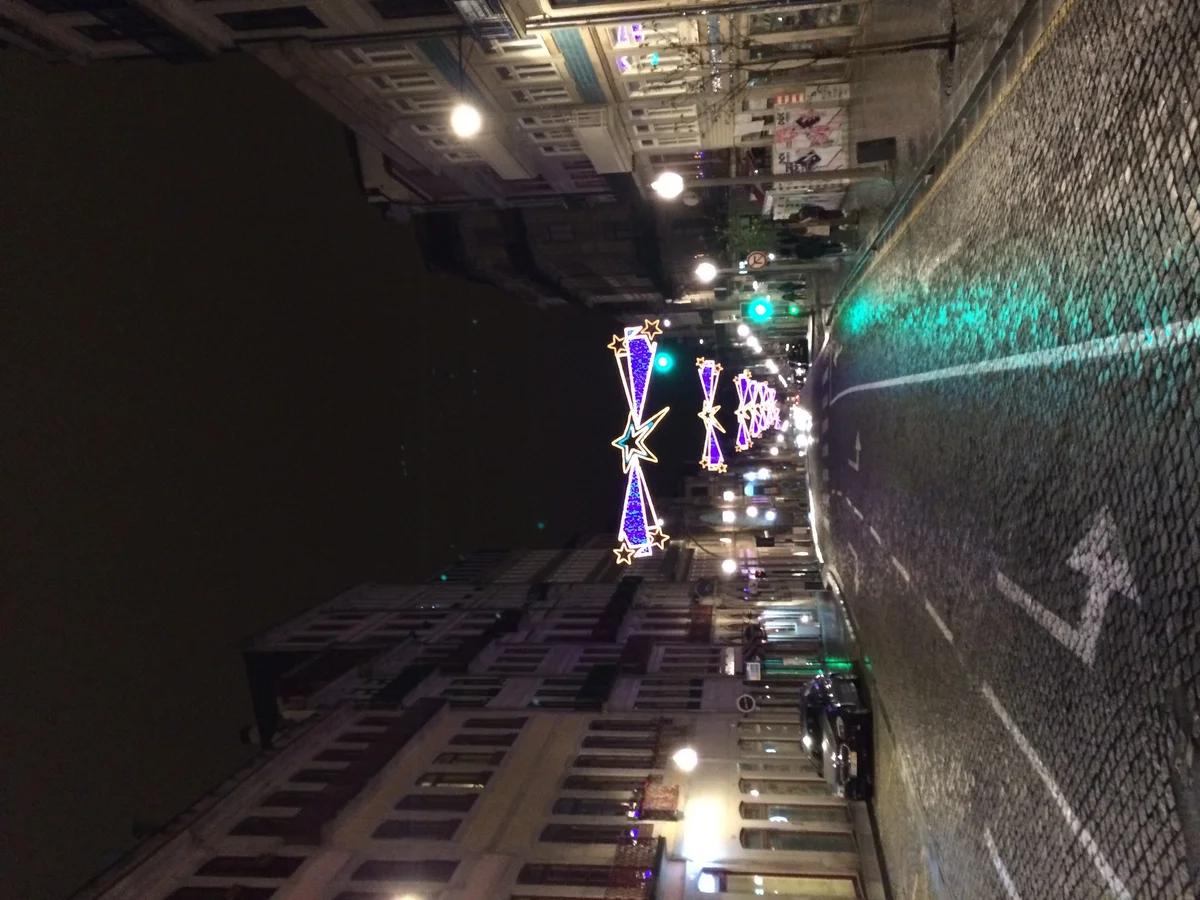Porto festive street adorned with illuminated star lights during Christmas season