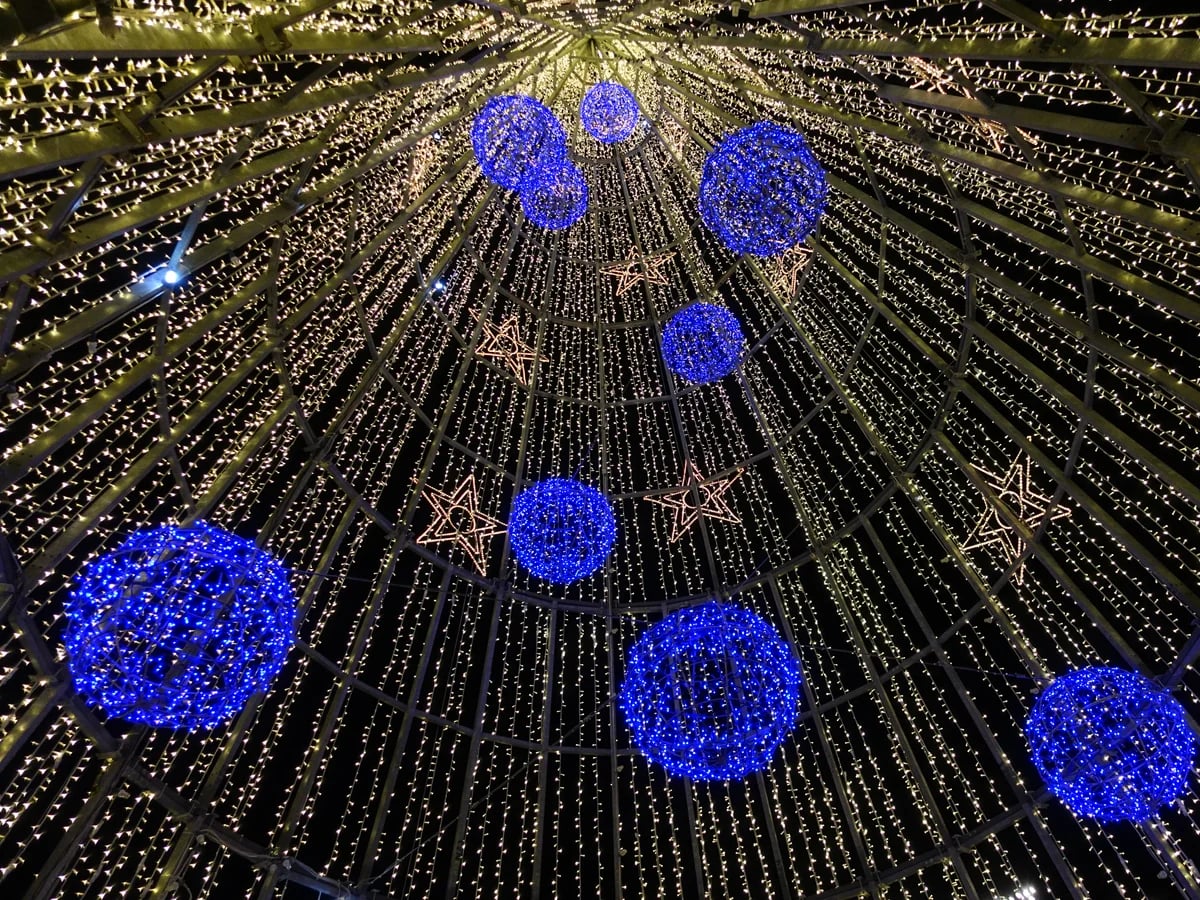 Porto festive street canopy with glowing blue spheres during Christmas