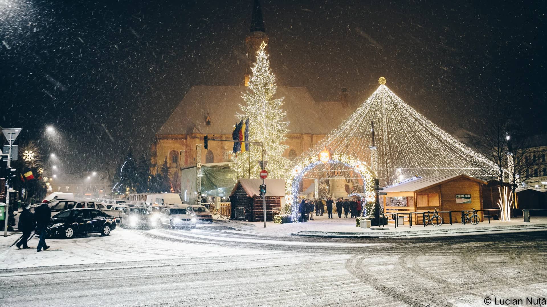 Cluj-Napoca St. Michael's Church illuminated during Christmas snowfall