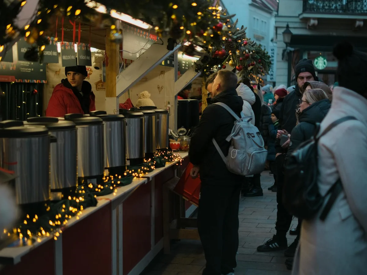 Bratislava authentic evening market scene with festive lighting in winter