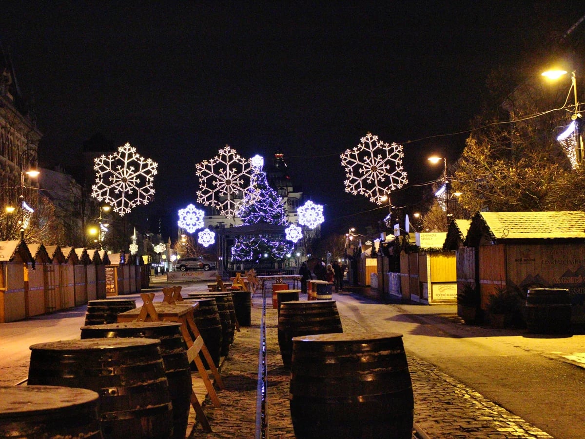 Košice glowing snowflake decorations in a magical blue-hour winter market