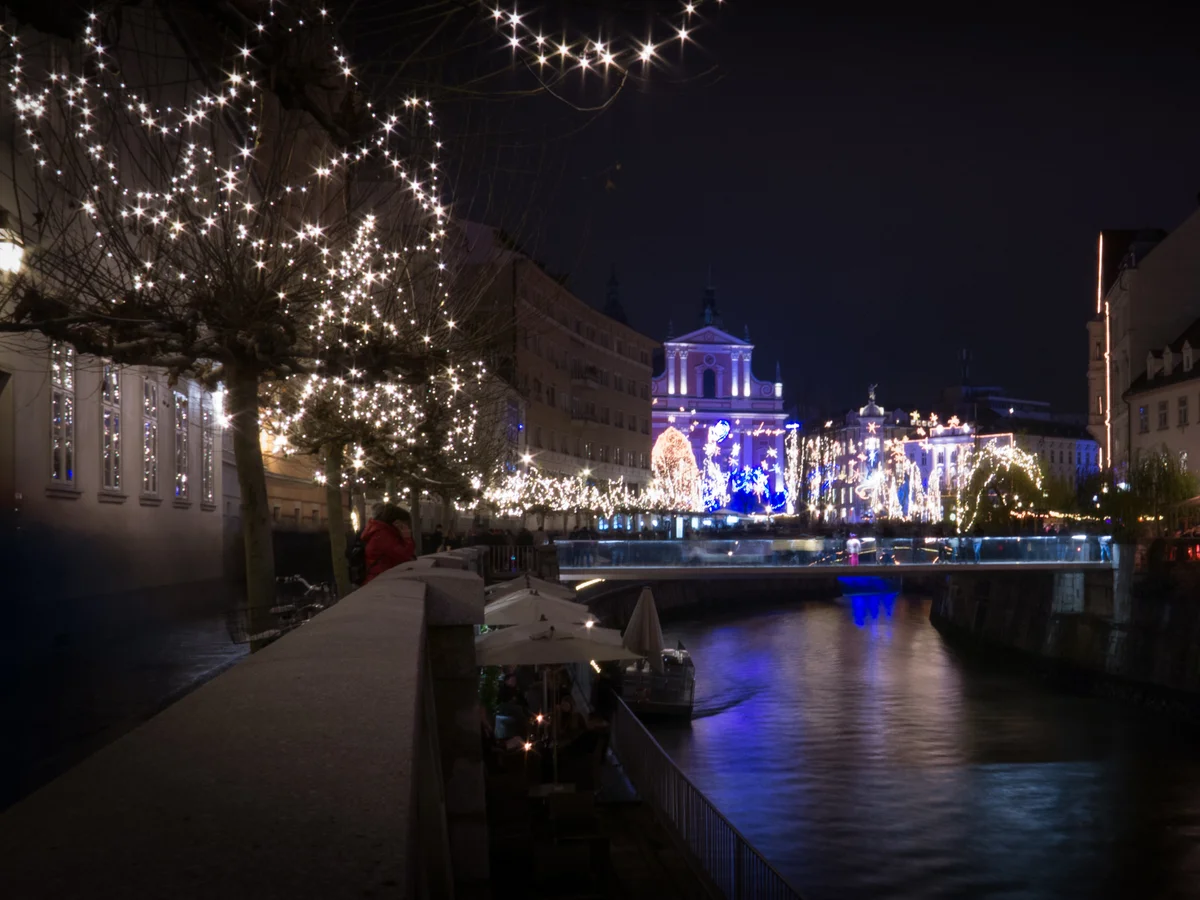 Ljubljana Cathedral illuminated in festive blue light during Christmas season
