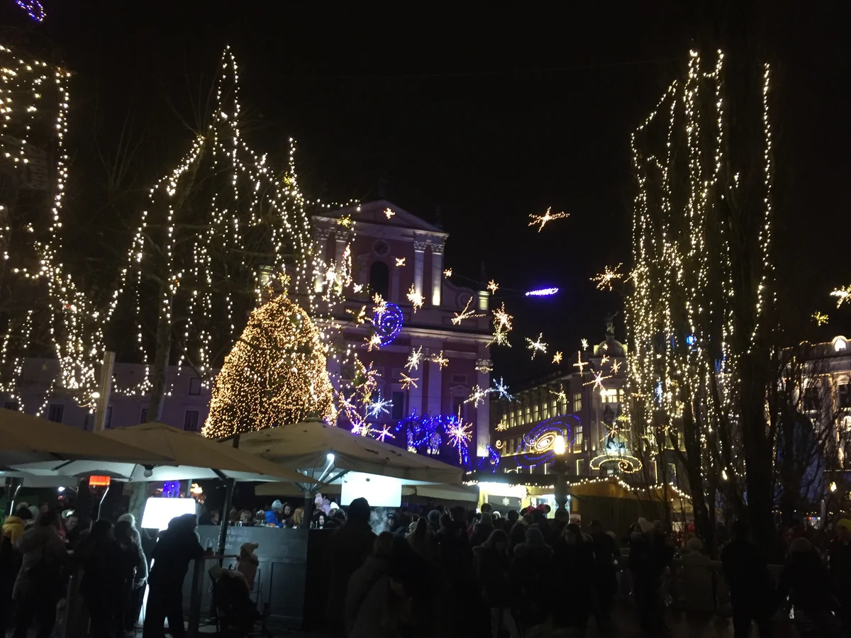 Ljubljana illuminated Christmas market square in winter night