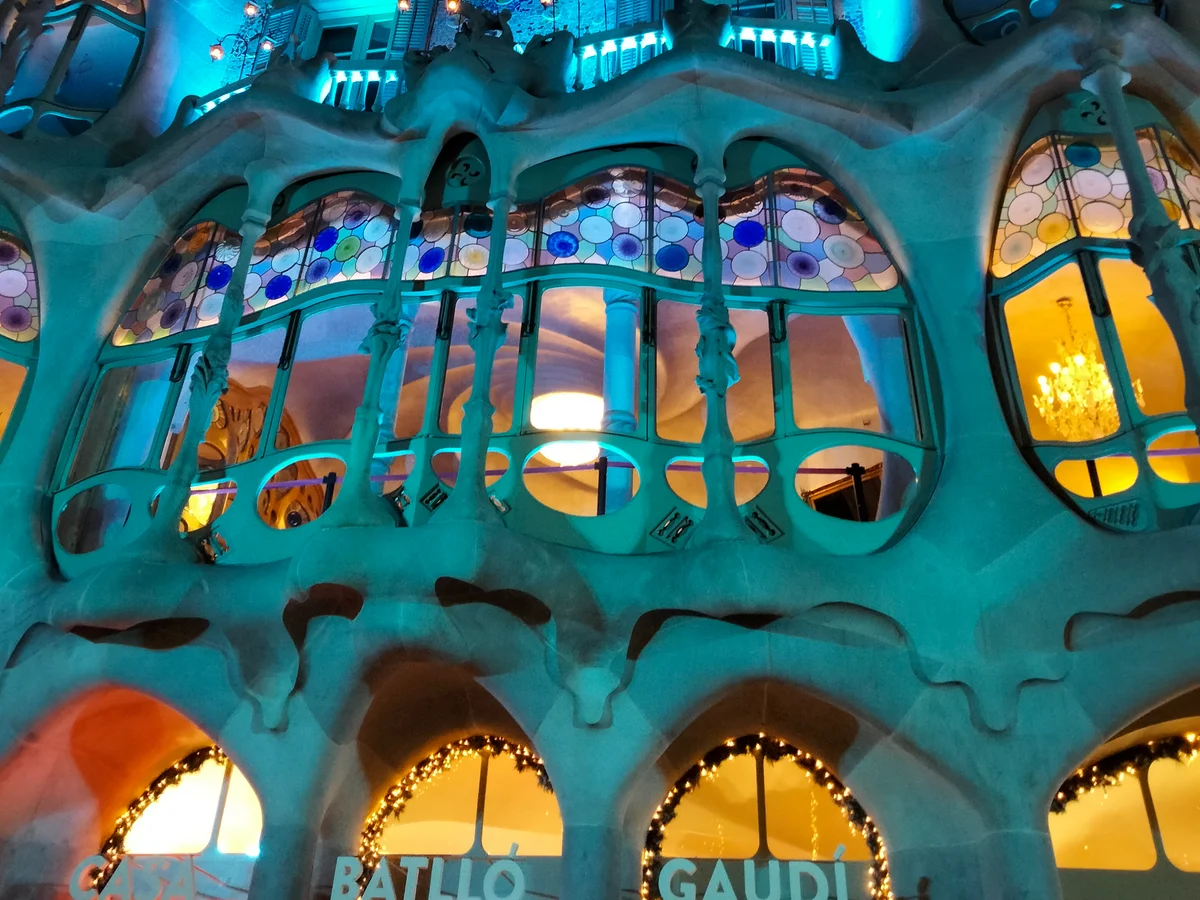Barcelona Casa Batlló illuminated in blue holiday lights during winter