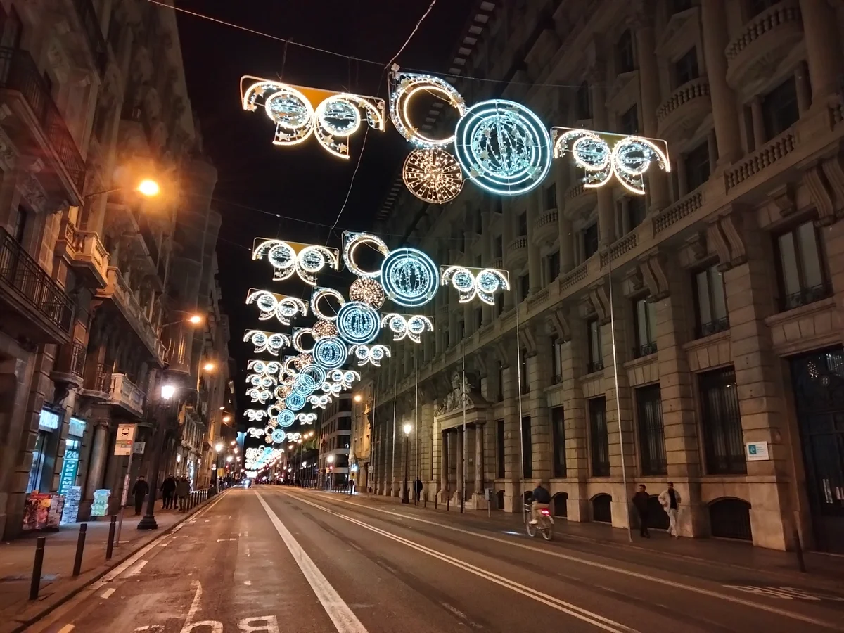 Barcelona Via Laietana adorned with festive Christmas lights during winter