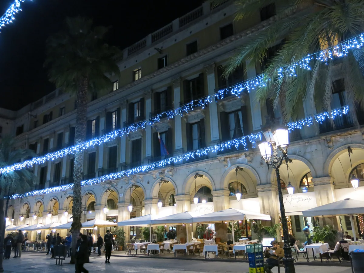 Barcelona Plaça Reial illuminated with blue festive lights during Christmas season