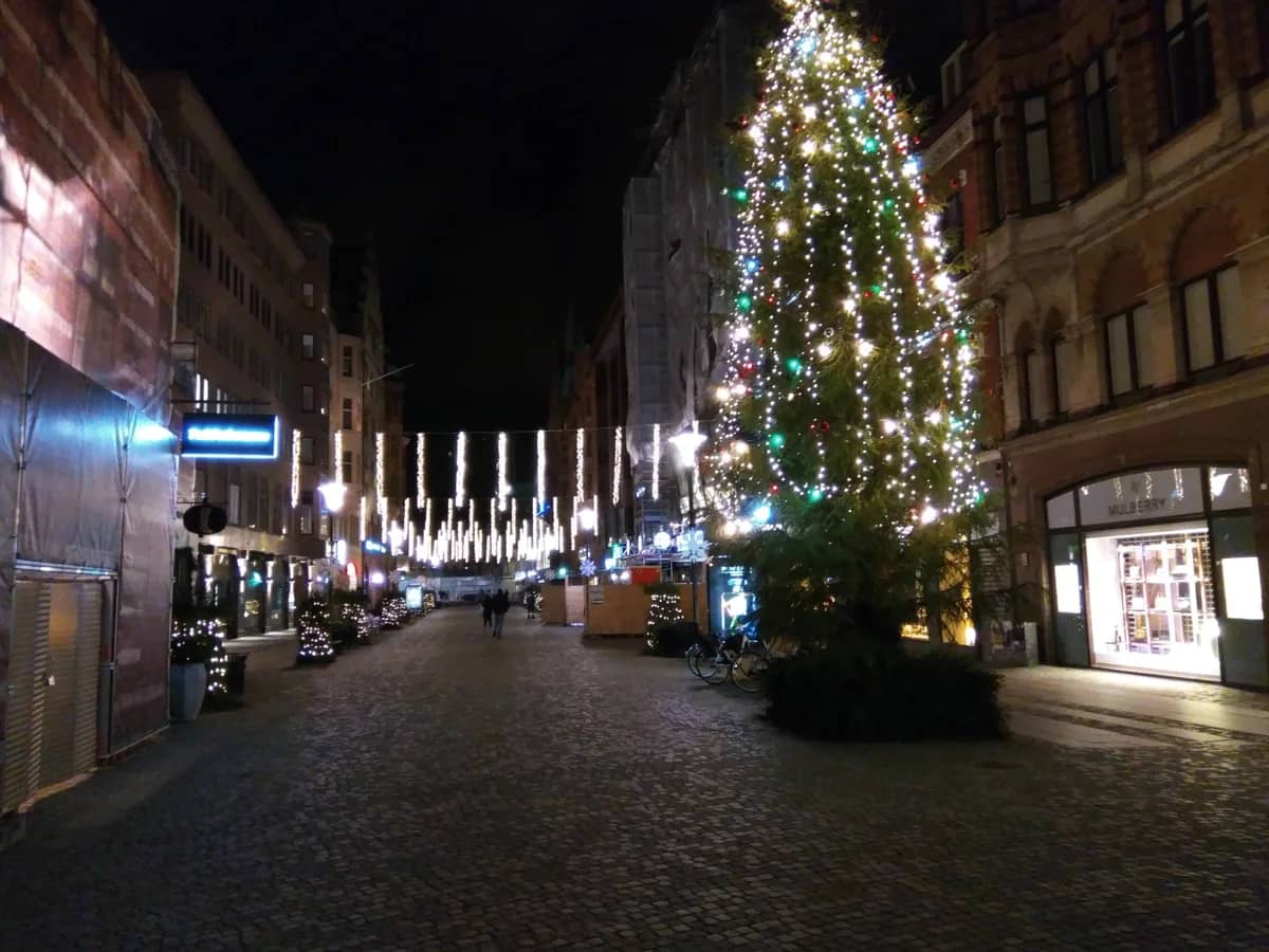 Malmö illuminated Christmas market street at blue hour