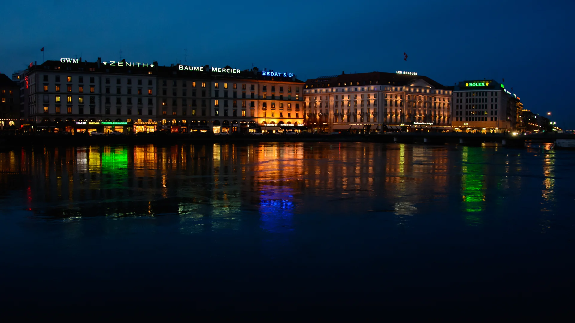 Geneva waterfront cityscape at blue hour during winter