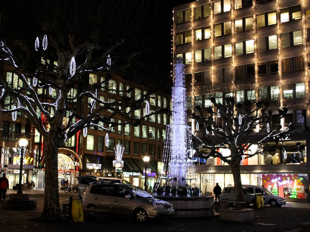 Geneva modern shopping district adorned with elegant blue and white Christmas lights